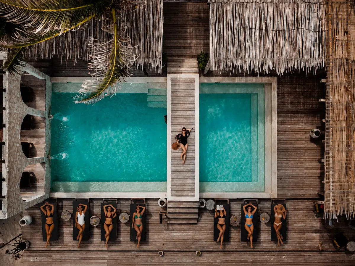 Aerial view of the pool with guests relaxing